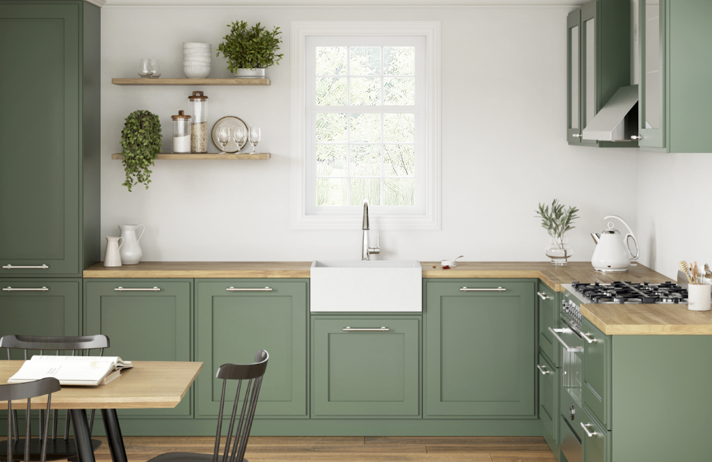 Cozinha premium com cuba farmhouse branca e armários verdes elegantes.